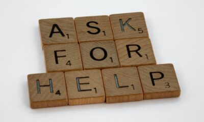 A group of scrabble blocks spelling out "ASK FOR HELP."