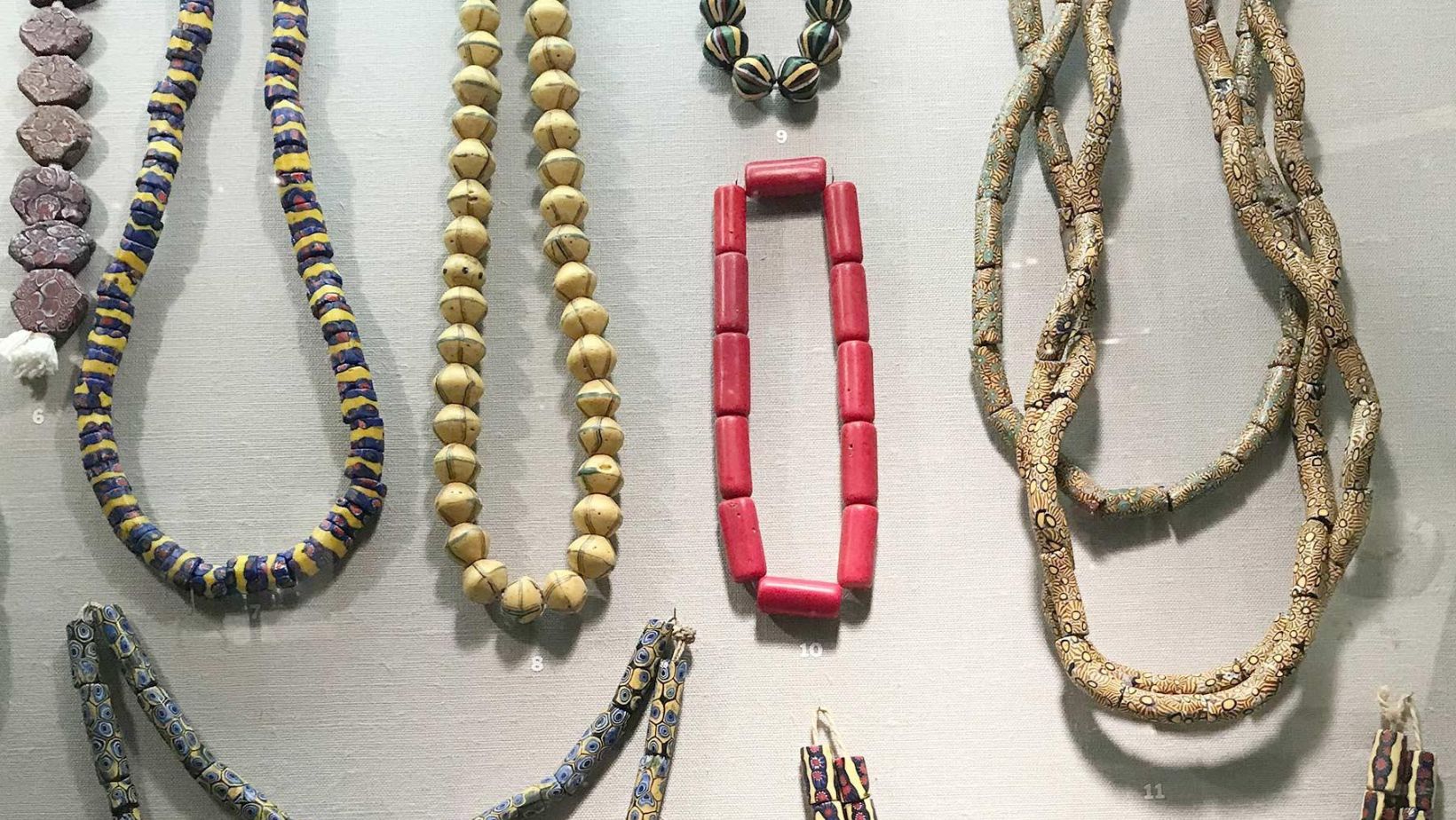Ancient glass jewelry beads, bracelets, and necklaces