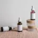 Free Minimalist display of assorted dropper bottles with blank labels on linen surface. Stock Photo