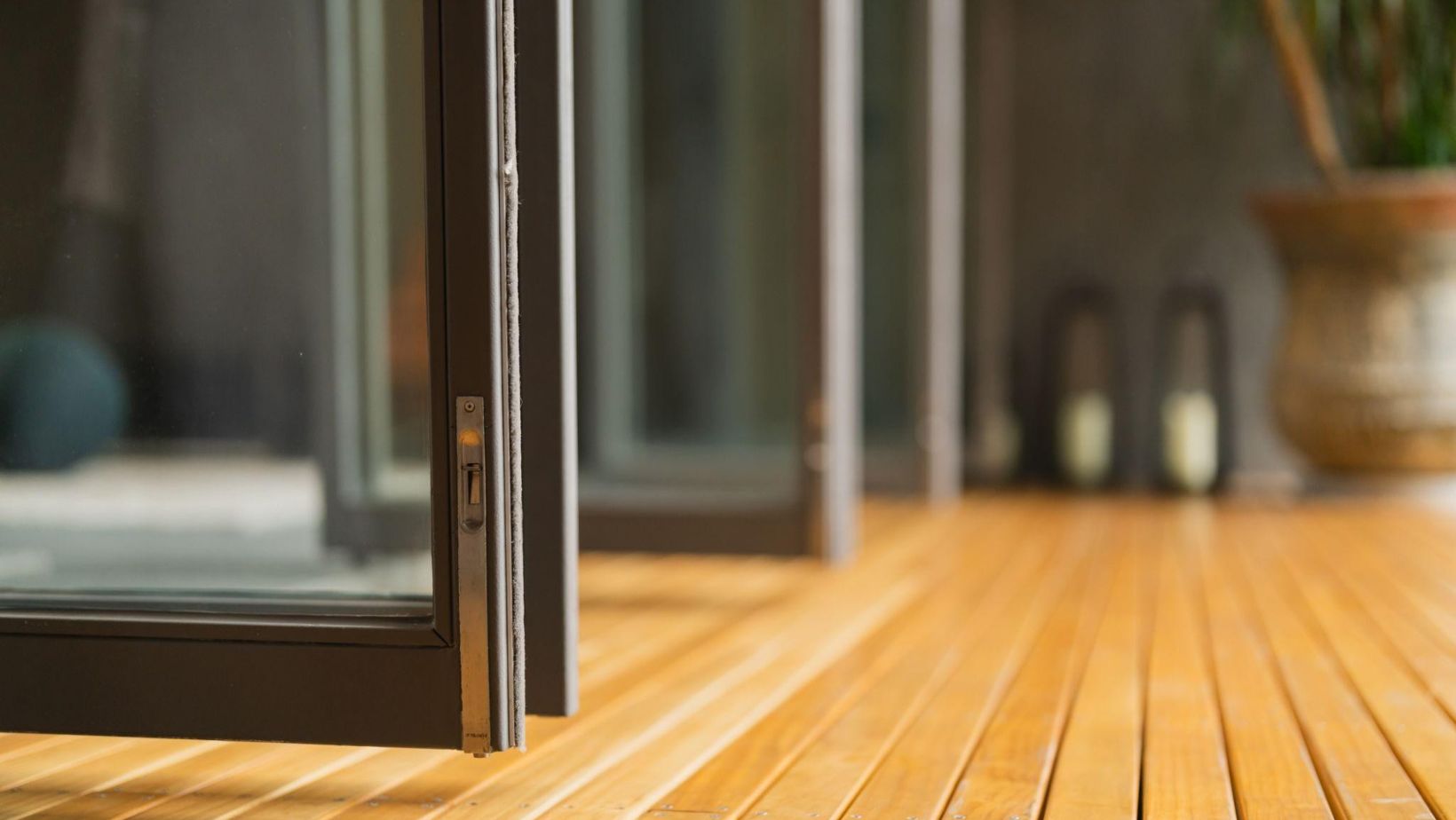 A seamless integration of a sliding door into a warm, inviting interior space, emphasizing the quality and functionality.
