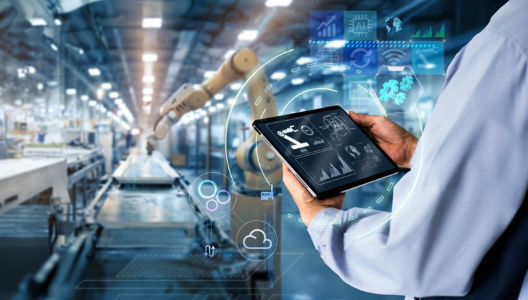 Worker using management software to optimize performance metrics in a modern industrial setting.